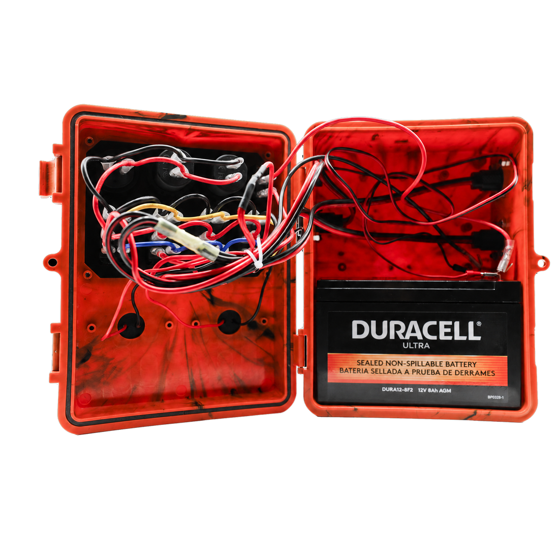 An orange waterproof hard case opened to show a red interior with a Duracell Ultra sealed non-spillable battery mounted on the right side and multiple red, black, white, and yellow wires connected on the left.