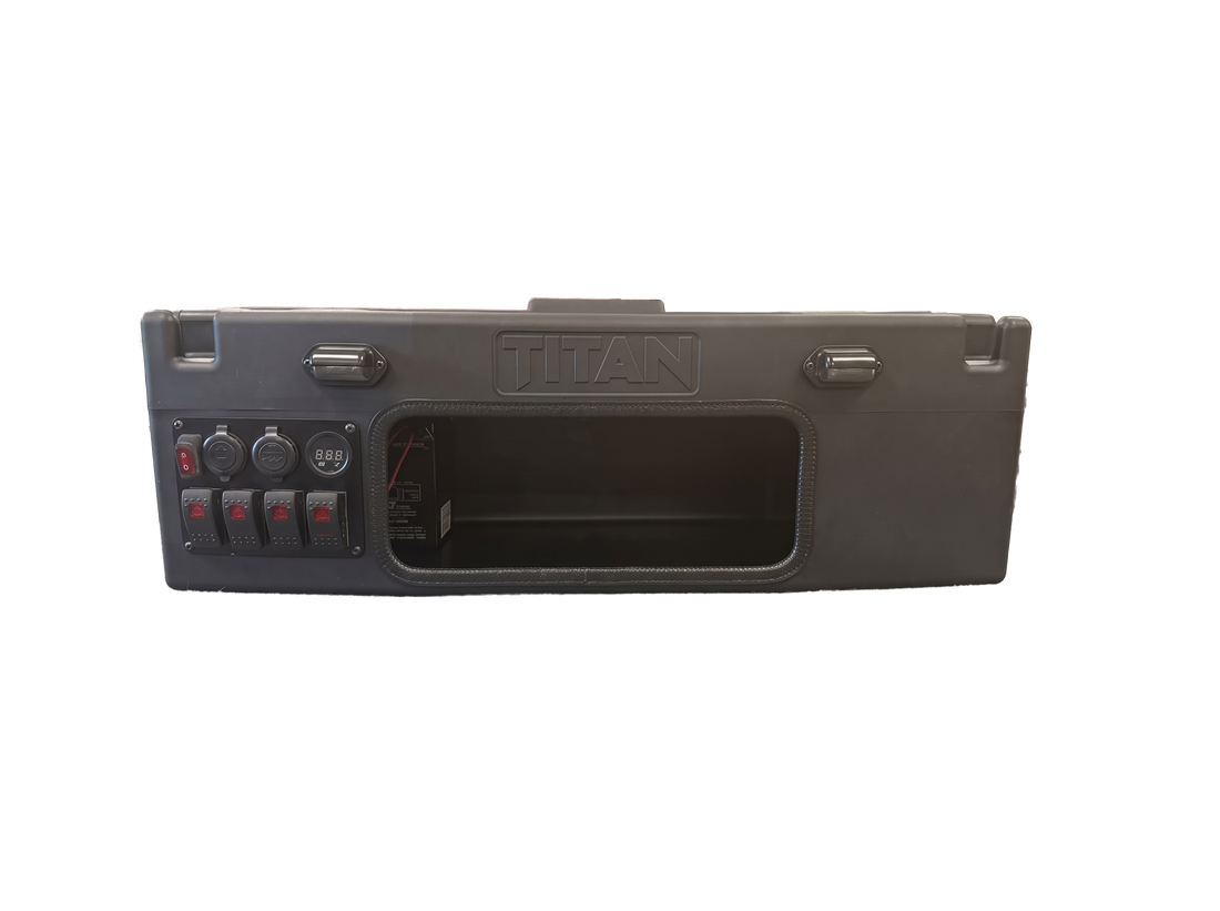 A rugged black tactical hard case with a built-in control panel featuring rocker switches, power outlets, and a large front cutout, shown on a plain white background.