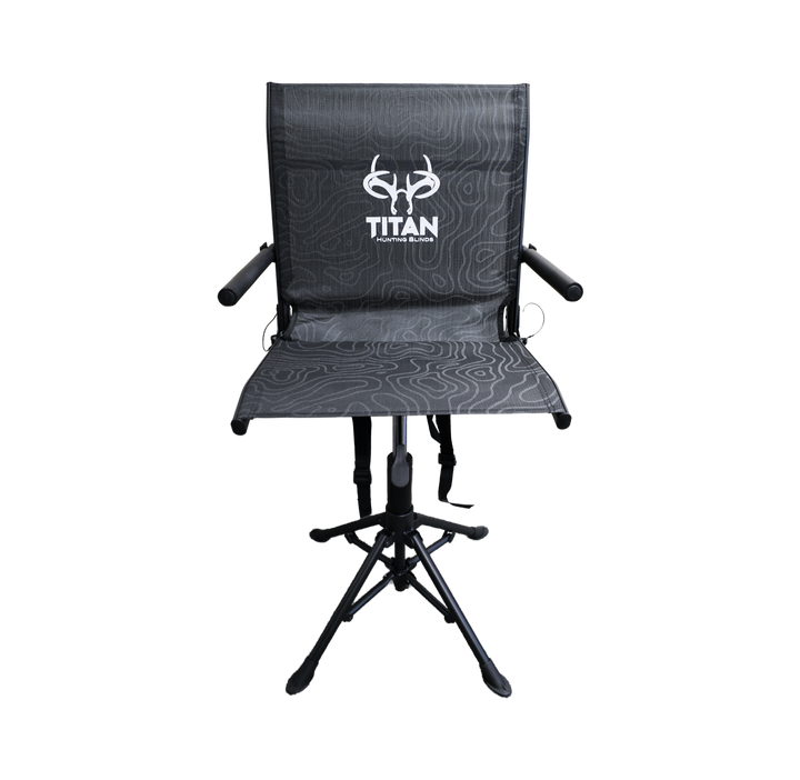 A black folding hunting chair with a textured seat and backrest, featuring a white 'TITAN' brand logo on the backrest, set against a plain white background.