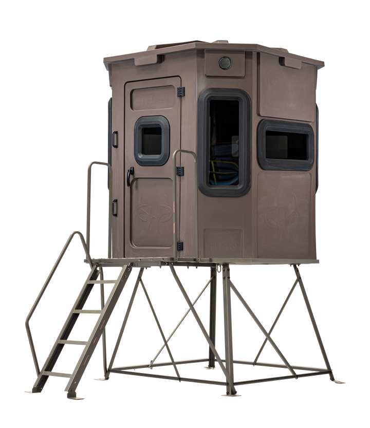 Titan Pro Archery & Rifle Combo Blind in tree-trunk brown, mounted on a 4ft tower with ladder
