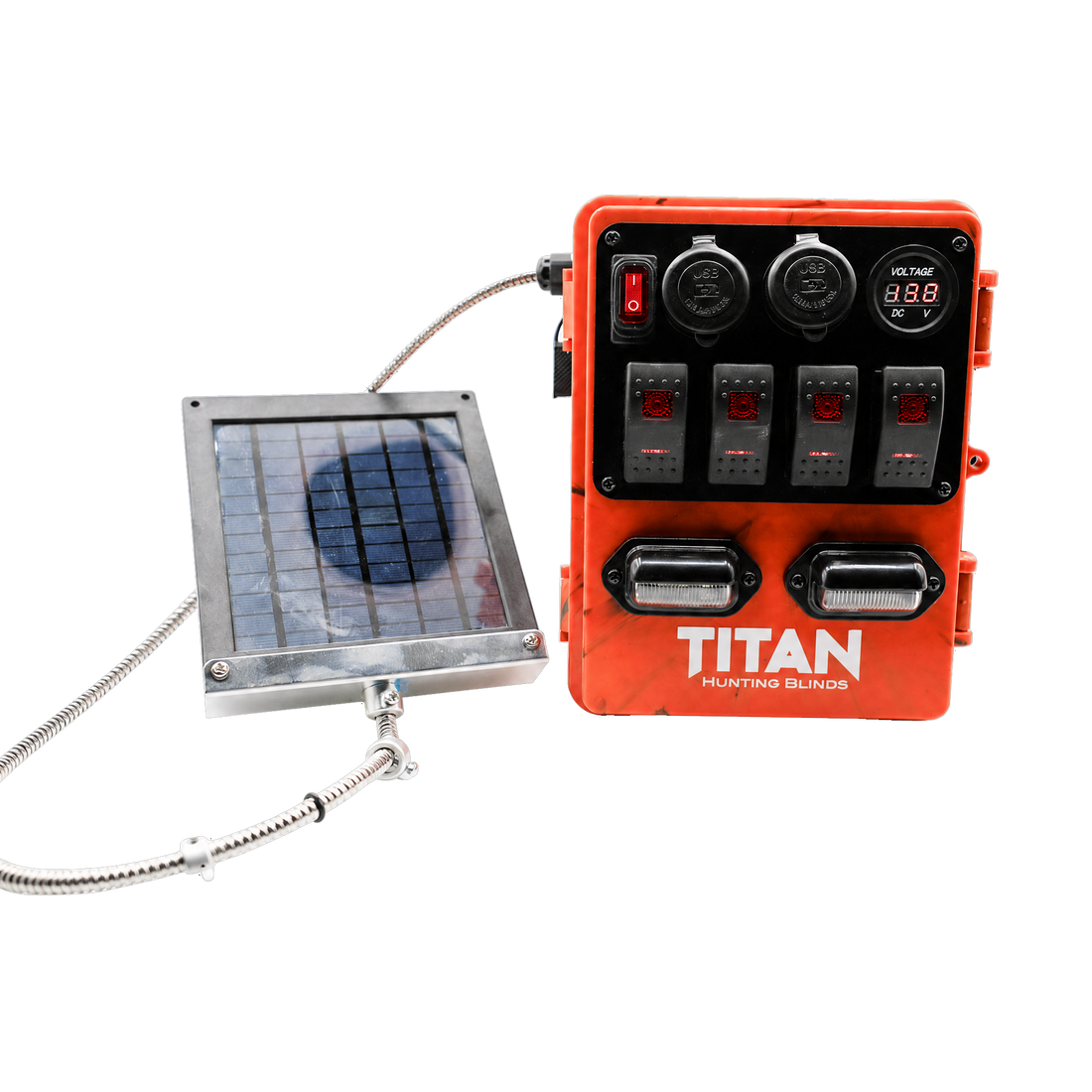 An orange TITAN Hunting Blinds power unit with multiple switches and outlets, shown next to a small solar panel on a white background.